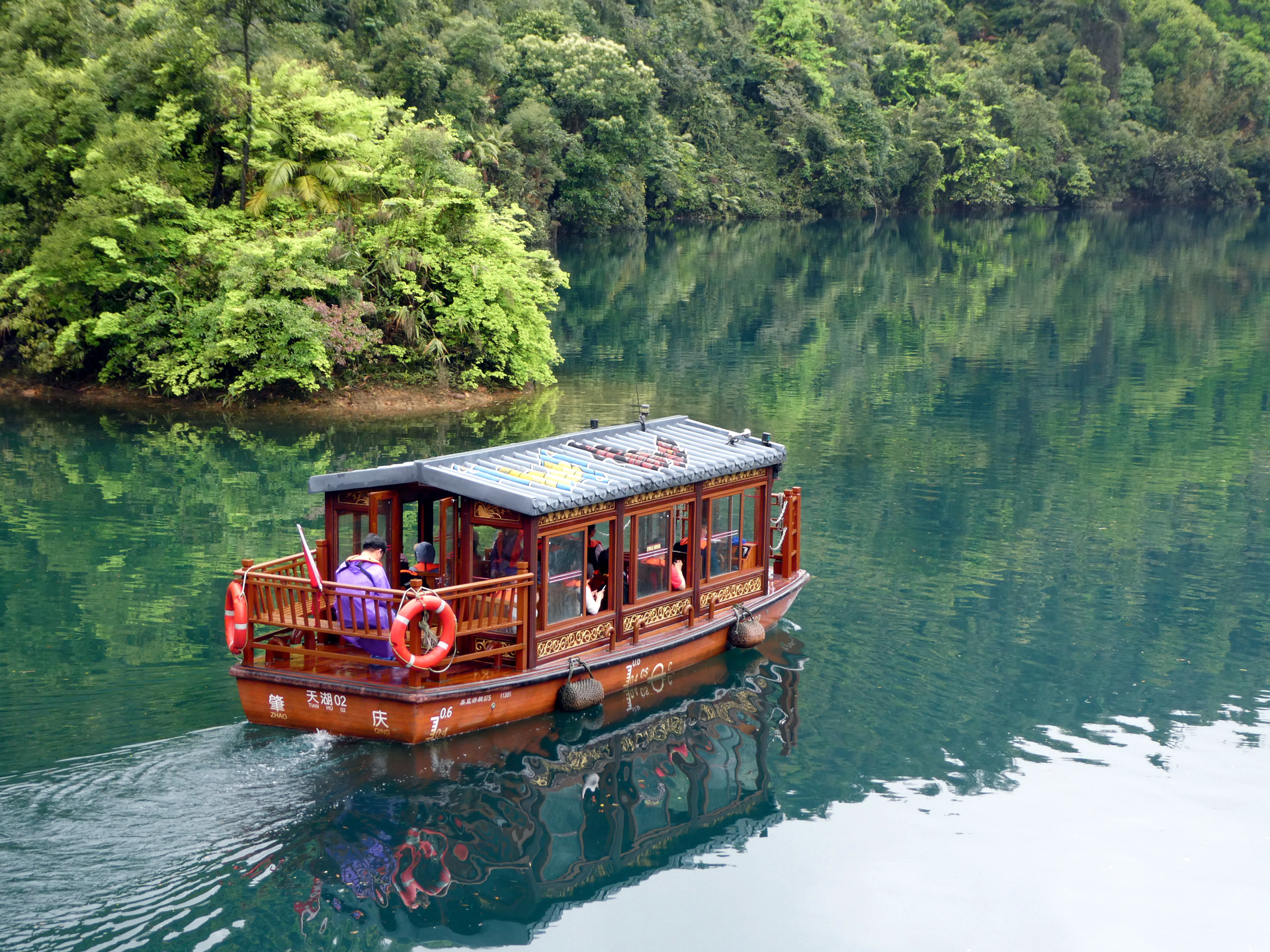 A boat floating across a Butterfly Lake