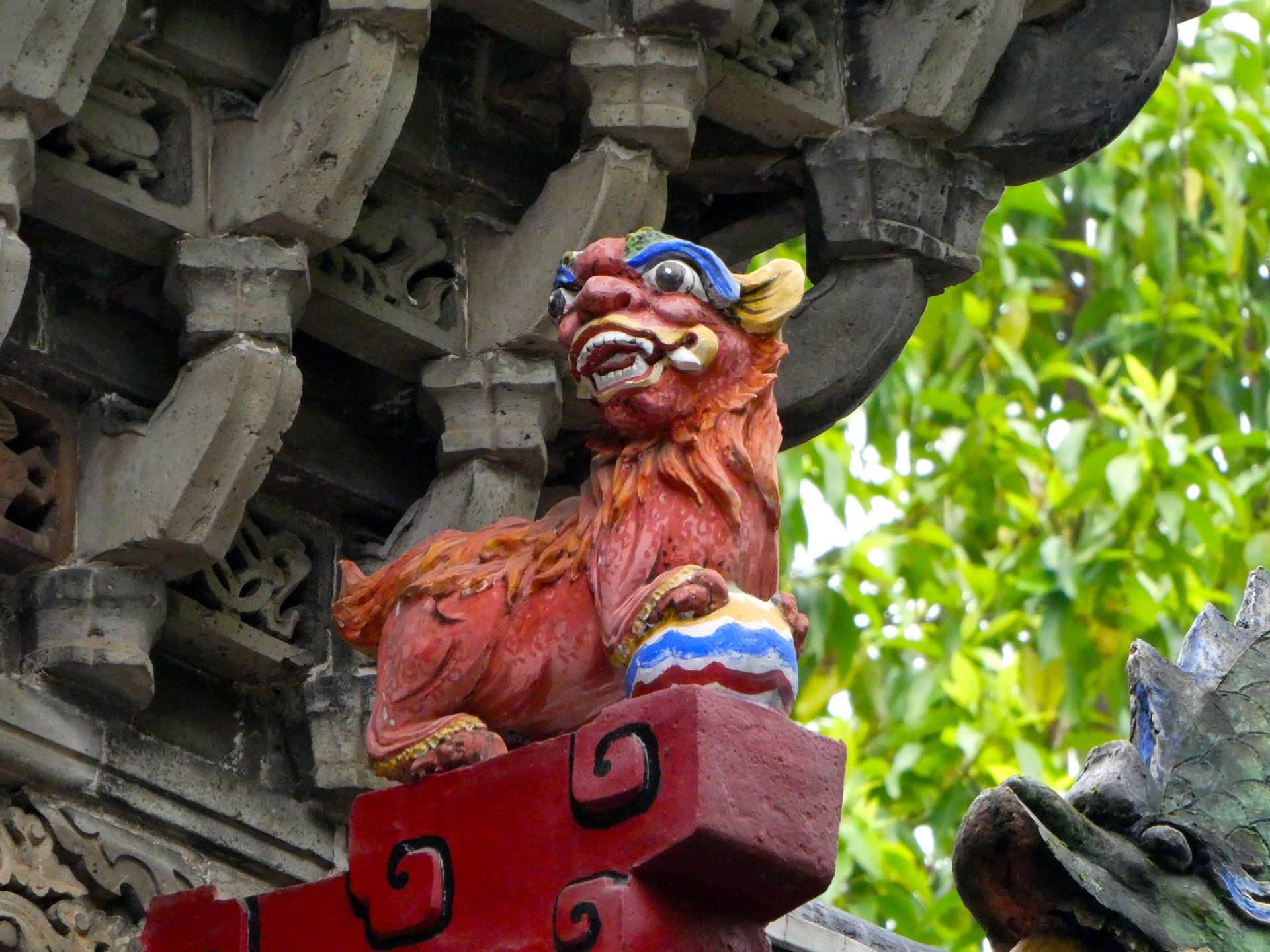 A figurehead sitting upon a gate